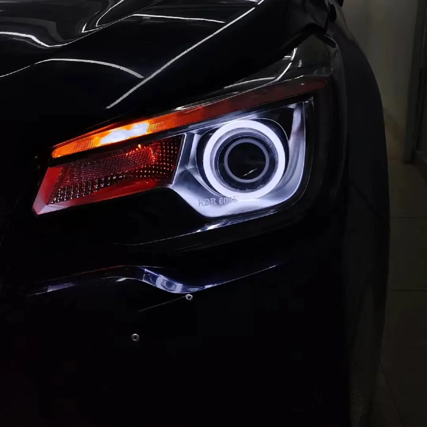 White angel ring glowing around a projector in a Subaru headlight