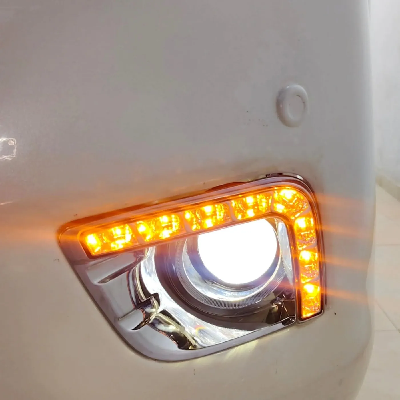 Amber running light on a Prado