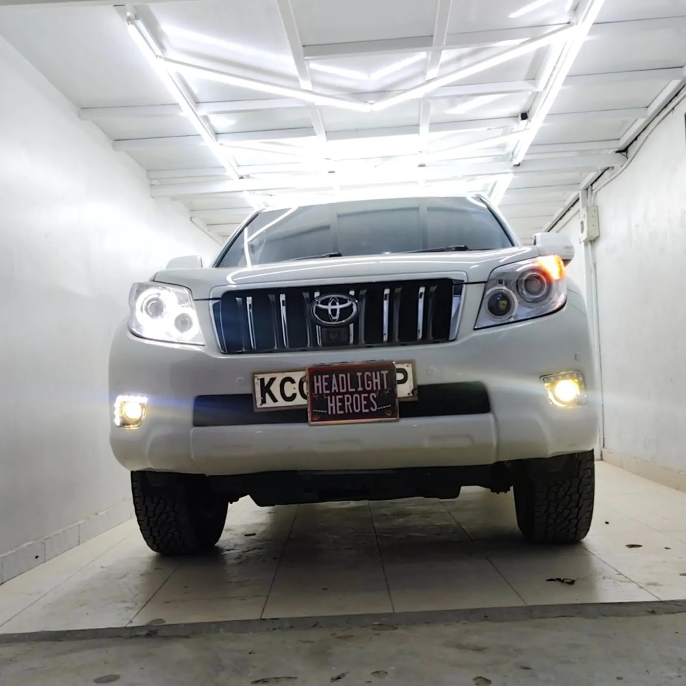 Toyota Prado with running lights on